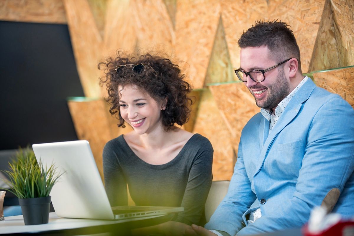 Couple discussing business at a coffee shop with hookah, conceptual