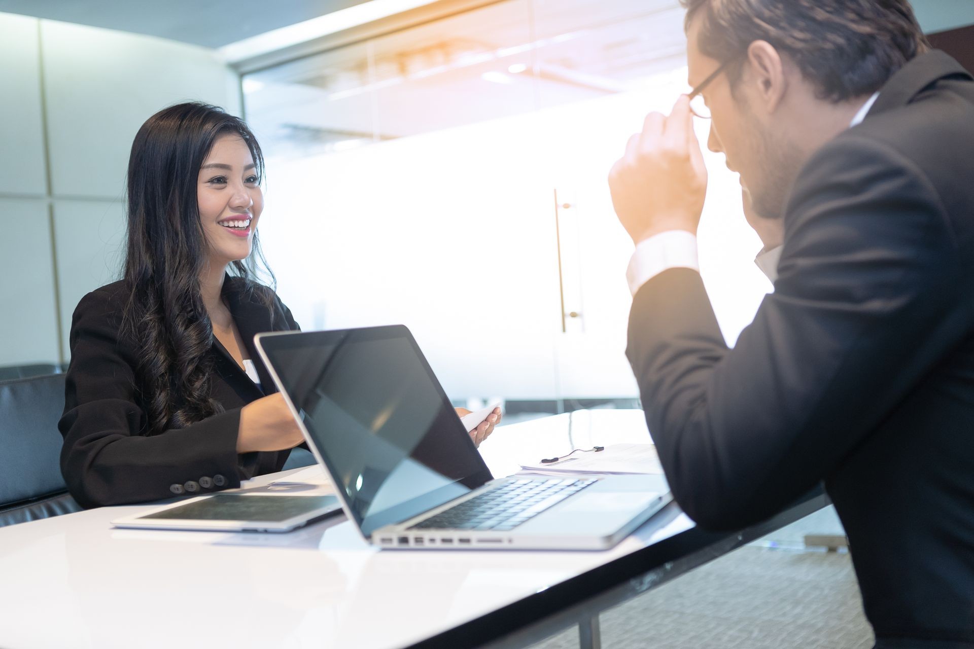 Young women attend a job interview handshake with an interviewer in modern office. Successful job interview with boss and employee handshaking.