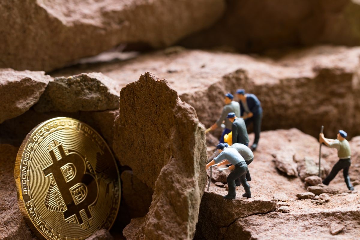 little miner is digging for bitcoin  . conceptual image for bitcoin mining and discovery crypto currency. , financial concept